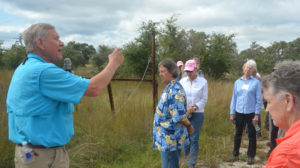 Dr. Barron Rector, Texas A&M AgriLife Extension Service range specialist, College Station, provided the women with a walking weed identification tour. (Texas A&M AgriLife photo by Kay Ledbetter)