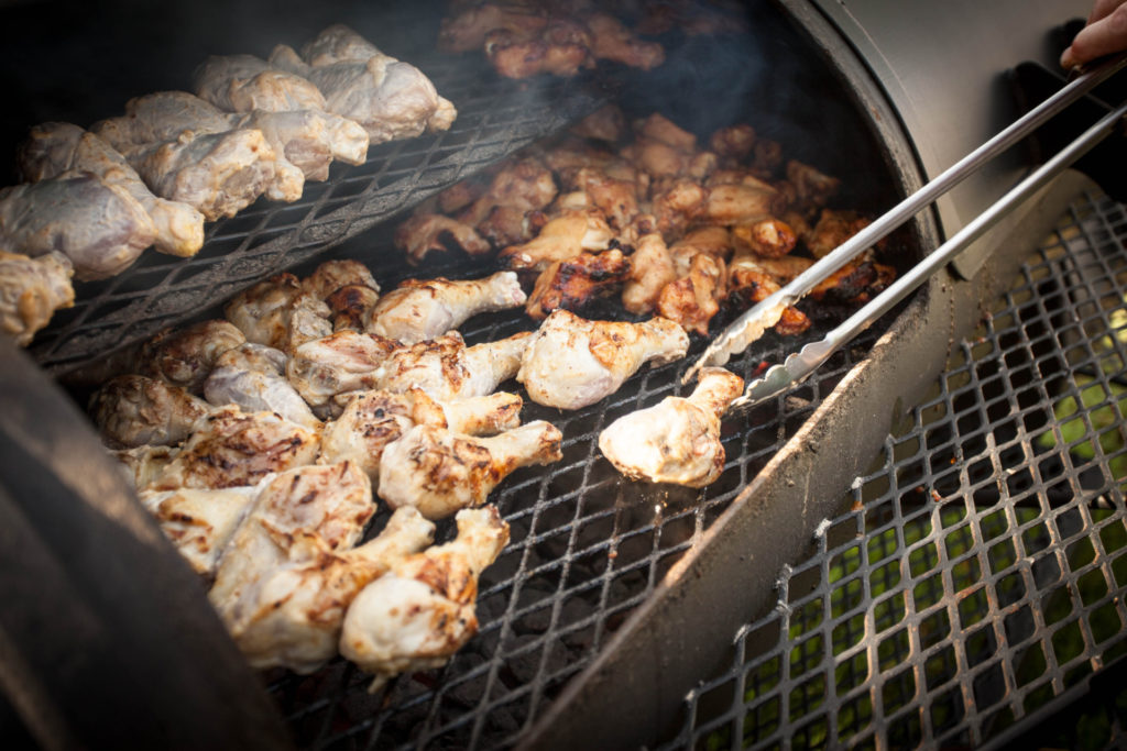 chicken legs and wings on a grill