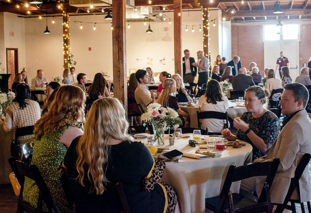 Recreation, Park and Tourism Sciences scholarship banquet with people sitting around round tables.