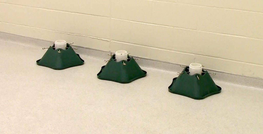 three green bases with a jar in each one