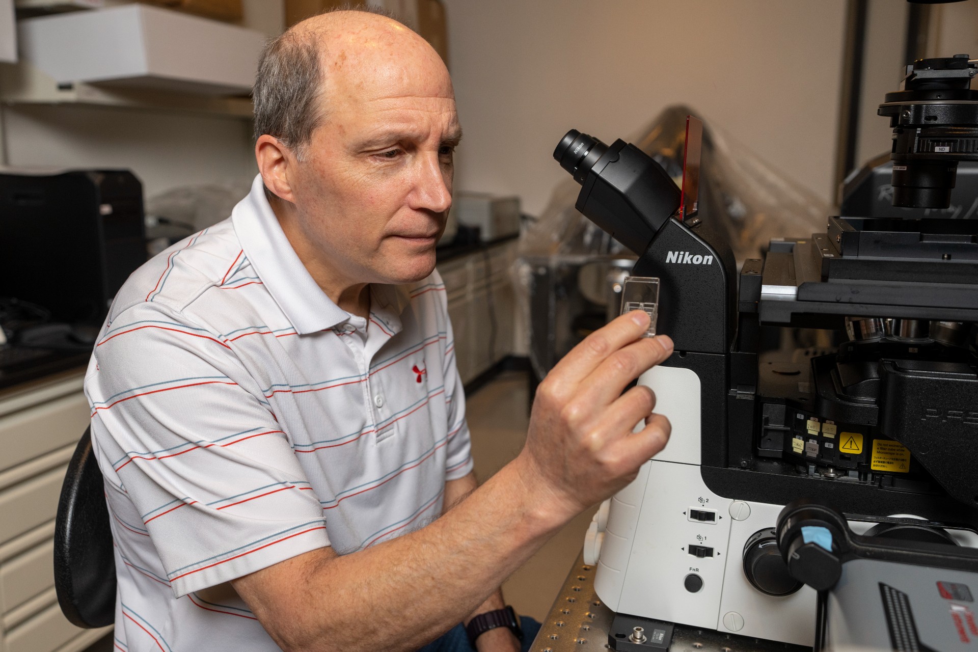 Dr. Chapkin in lab looking at sample