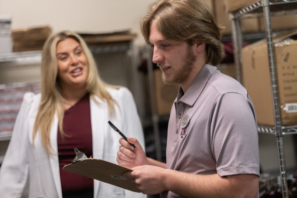 a student holding a clip board