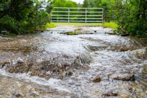 water flowing over rocks in a flood