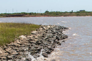 a rocky shoreline long a river bend