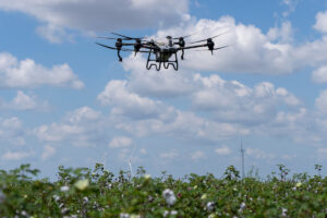 A photo of an unmanned aerial vehicle capturing crop data information.