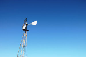 windmill with a blue sky in the background
