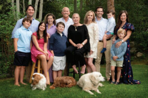 Family photo of several generations of the Rosenthal family in an outdoor location with trees as a backdrop