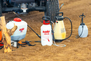 pesticide sprayers sitting on the ground