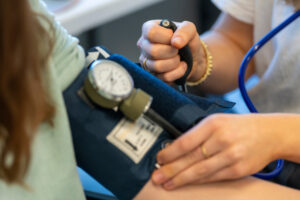 A person having their blood pressure taken