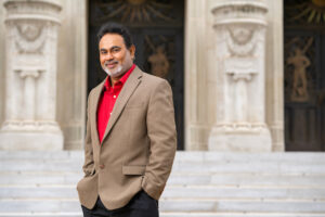 Sandun Fernando, Ph.D., standing in front of a building with his hand in his pocket